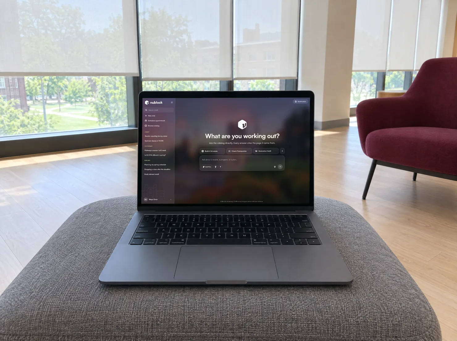 A laptop open to Ndex in a bright campus study lounge